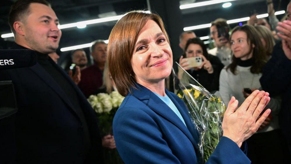 Moldova’s President Maia Sandu smiles after her re-election