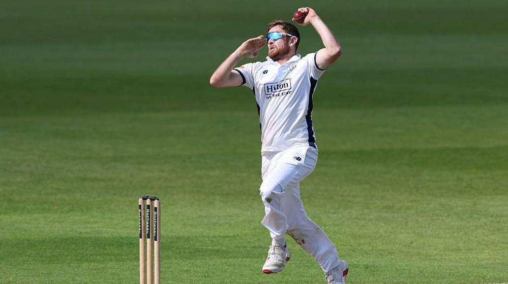 Liam Dawson in action bowling for Hampshire