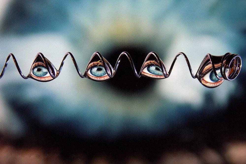 An eye reflected in drops of water