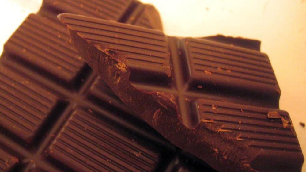 A shot of chunks of dark chocolate.