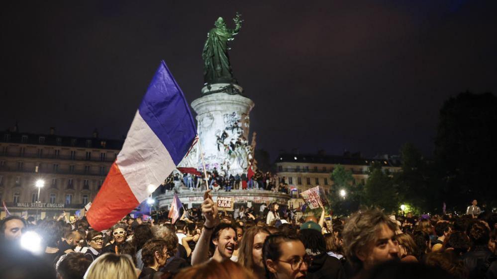 People react after the second round of the French legislative elections results at Place de la Republique in Paris, France, 07 July 2024.