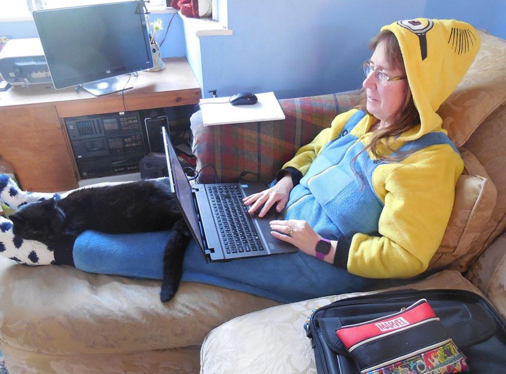 Woman on sofa dressed as a Minion