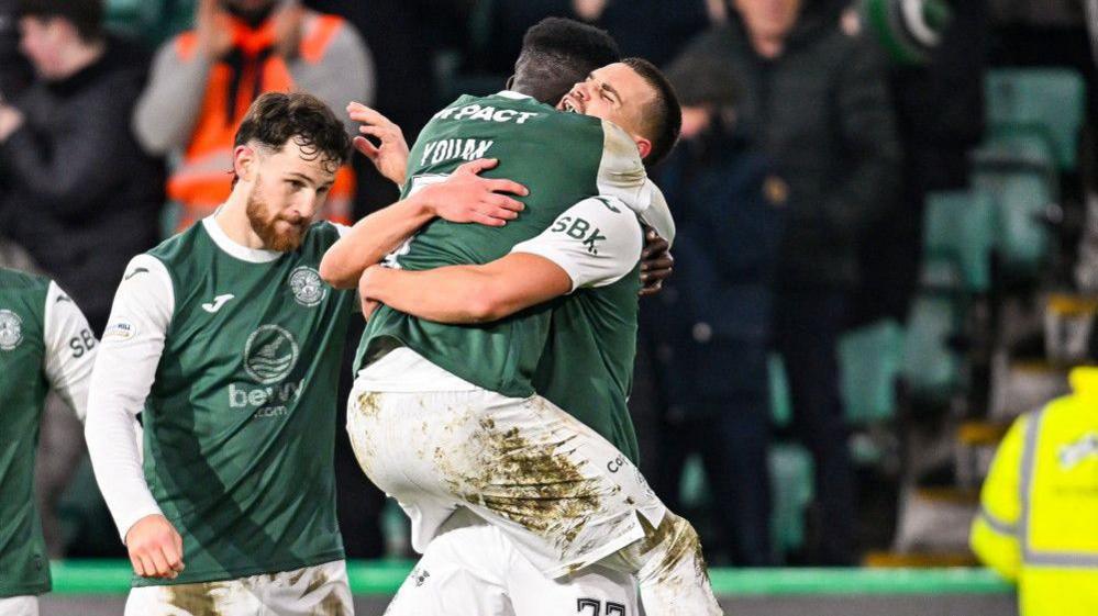 Hibernian's Ante Suto (R) celebrates scoring to make it 3-2 with teammates Elie Youan (C) and Jack Iredale during a William Hill Premiership match between Hibernian and Dundee United at Easter Road