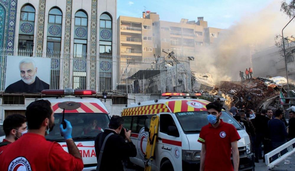 The rubble of a destroyed building lies next to Iran's embassy in Damascus on 1 April