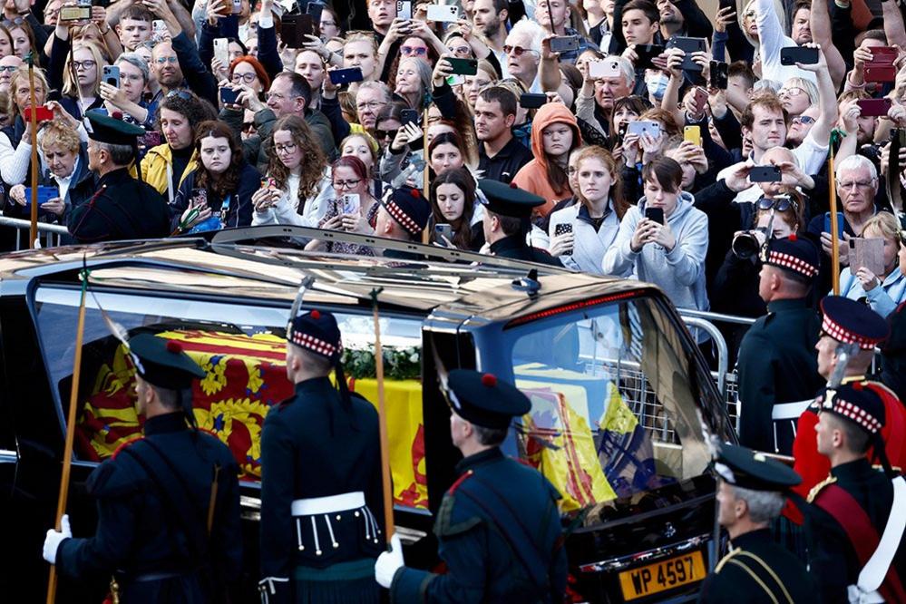 Crowds watch the procession