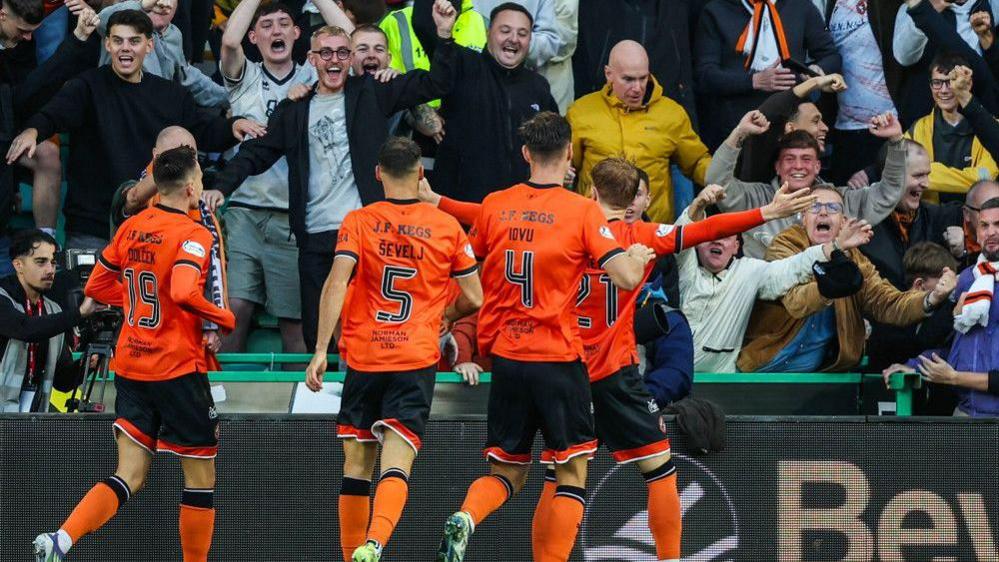 Dundee United's Luca Stephenson celebrates after scoring to make it 3-1