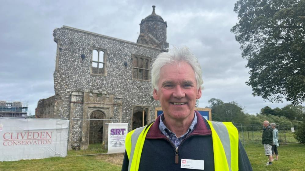 Joseph James standing outside the outer gatehouse at Baconsthorpe Castle