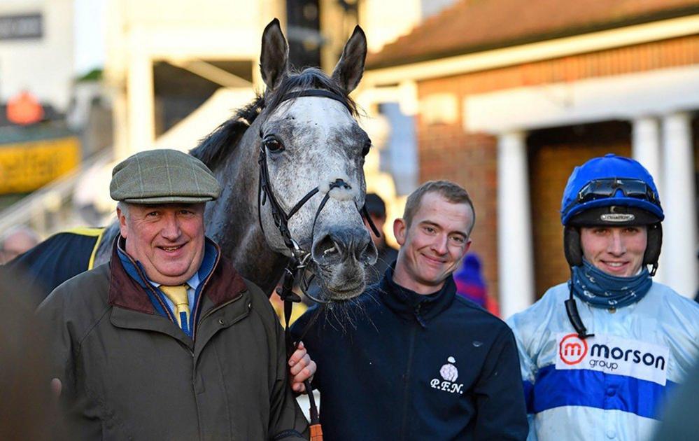 Kirkby (centre) pictured with trainer Paul Nicholls (left) and jockey Harry Cobden (right)