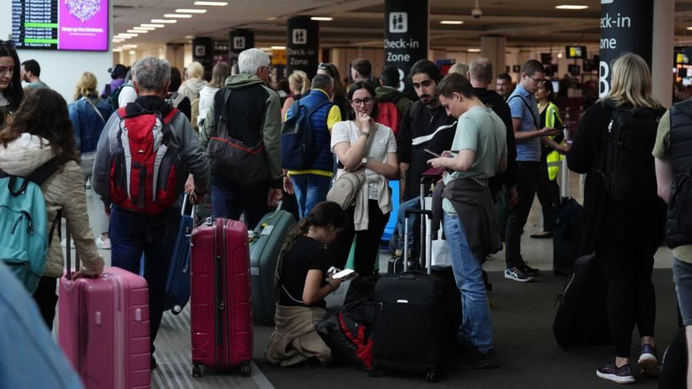 Passengers waiting at Edinburgh Airport