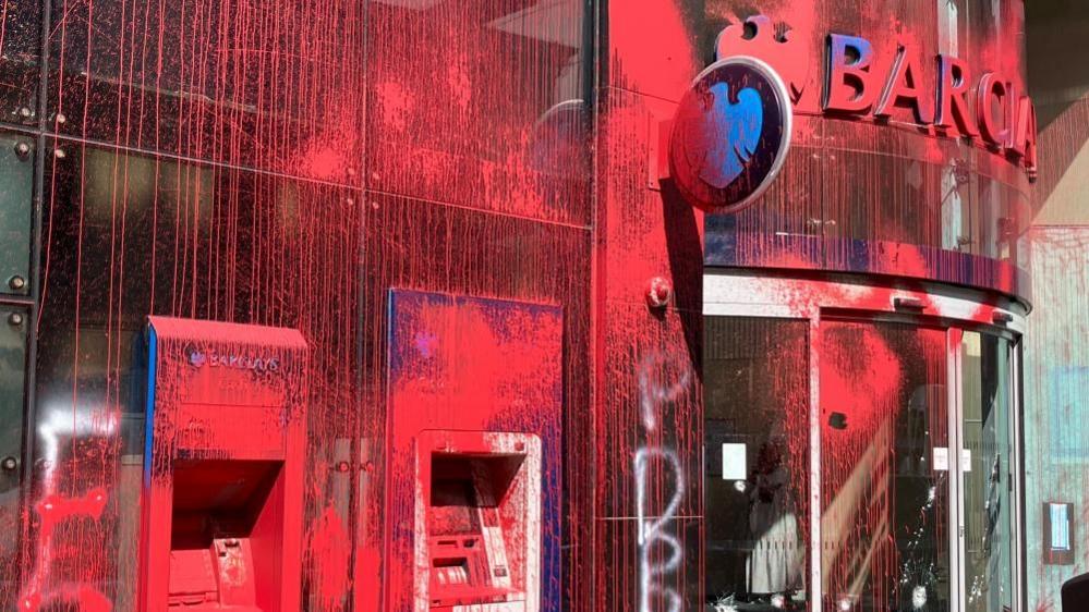 Barclays in Leeds city centre covered in red paint