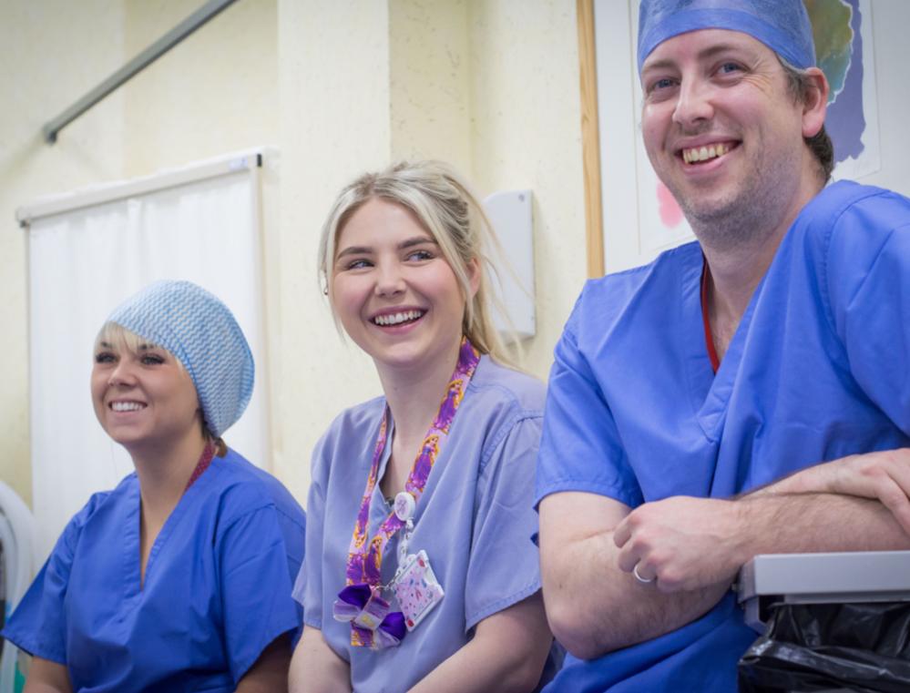 Staff at the ITU smile