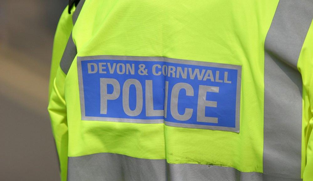 A generic photo shows the back of a Devon and Cornwall Police reflective jacket, with the person wearing it remaining anonymous. Picture taken in Cornwall in 2007.