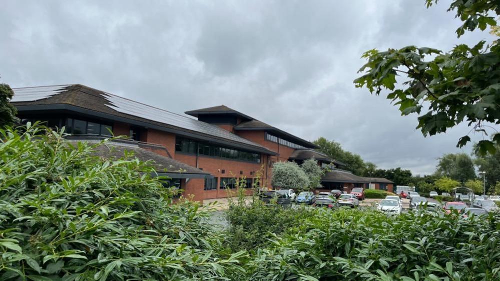 Two-storey office building in The Lakes in Northampton, with Opus Energy sign outside