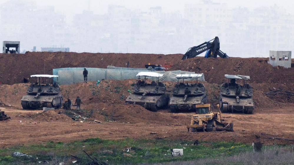 Israeli military vehicles and construction equipment inside Gaza