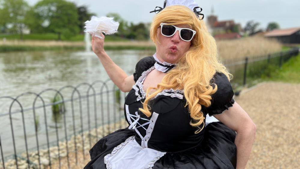 A man dressed up as a maid for the mud run