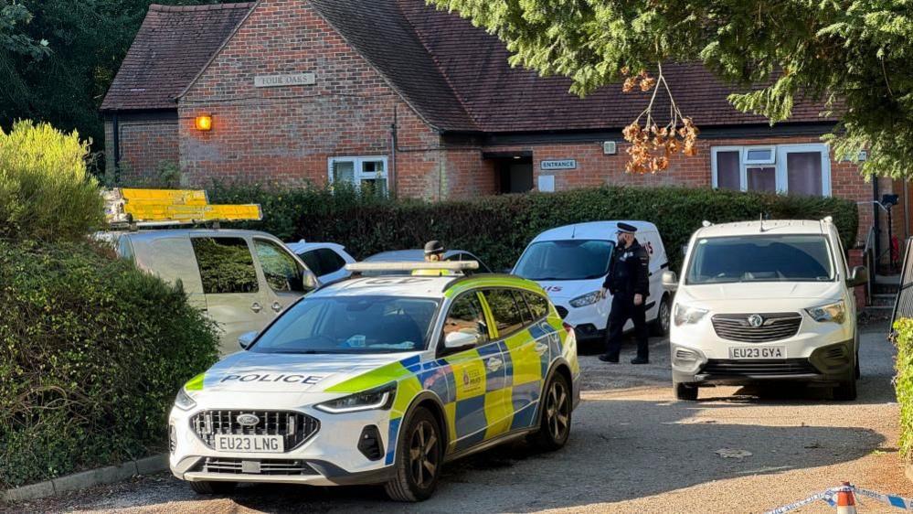 A number of police cars in Ingrave Road, Brentwood, including police officers 