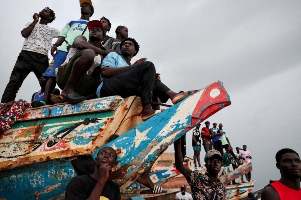 People watch a soccer game between two teams from the neighborhood in Toubab Dialaw on the outskirts of Dakar, Senegal, September 25, 2024