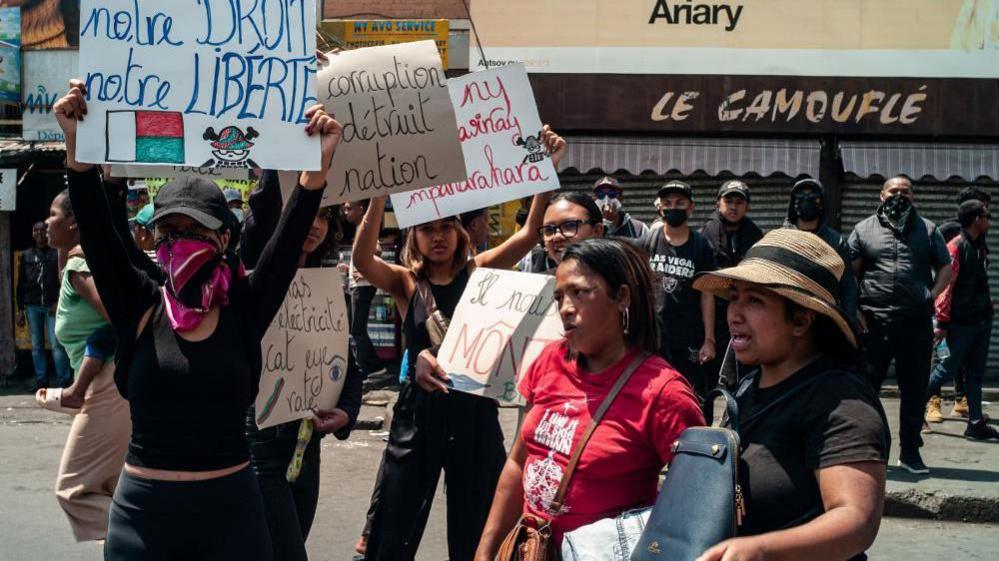 Women holding signs at the protest