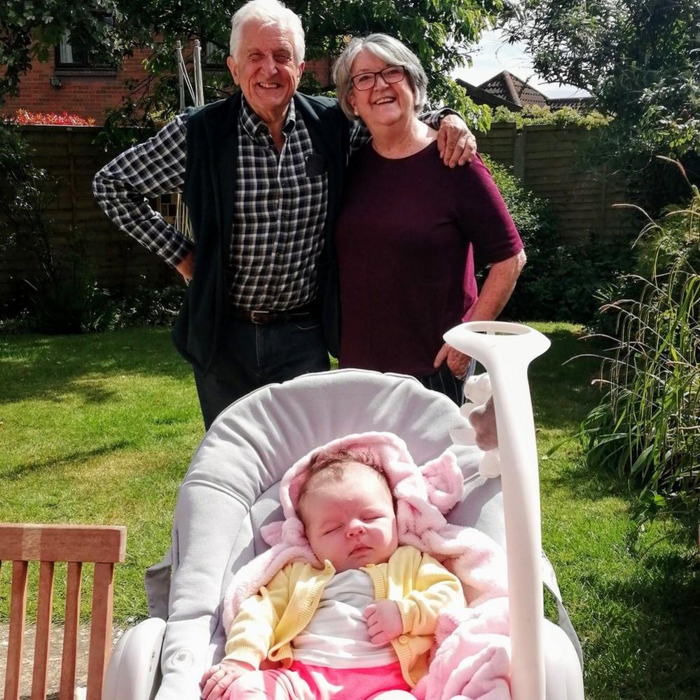 Grandparents meet their new grandchild