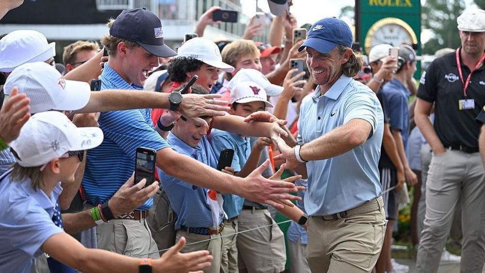 Tommy Fleetwood greets fans