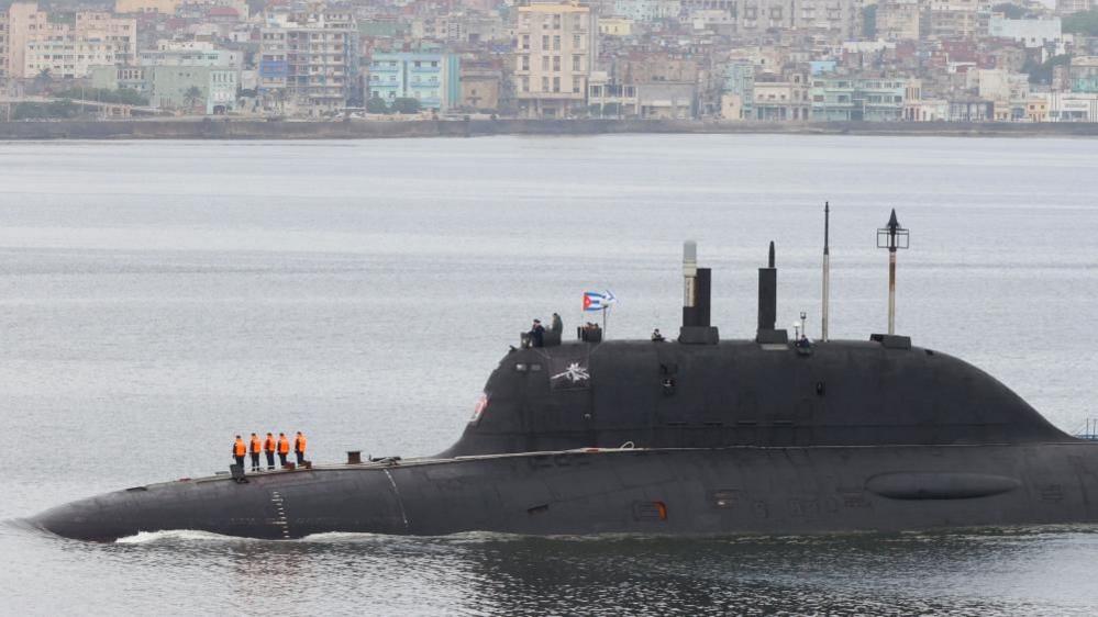 A Russian submarine partly submerged in water