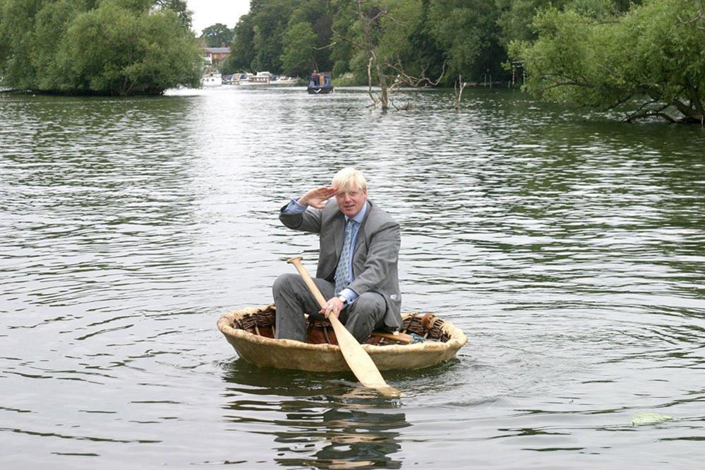 Boris Johnson takes to the water on the River Thames in a coracle in aid of Save The Children.