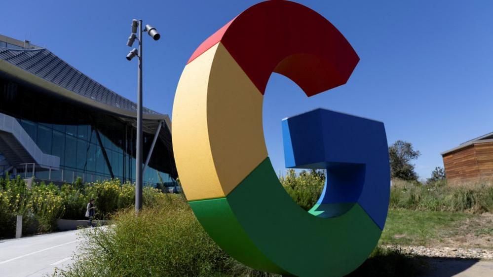 A statue of the first letter of Google's company name in its signature red, yellow, green and blue, sits on the campus of the US tech giant in Mountain View, California, US