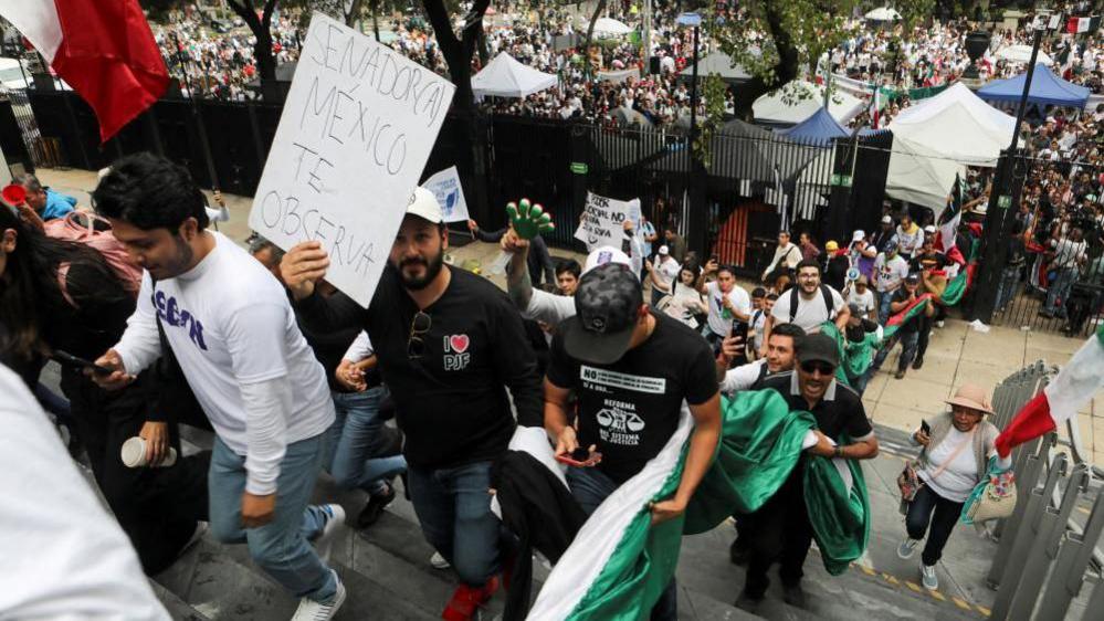 Demonstrators enter the Senate building as a highly contested judicial reform proposal is debated, following its approval by the Chamber of Deputies and backing by senators at the commission stage, in Mexico City, Mexico, September 10, 2024.