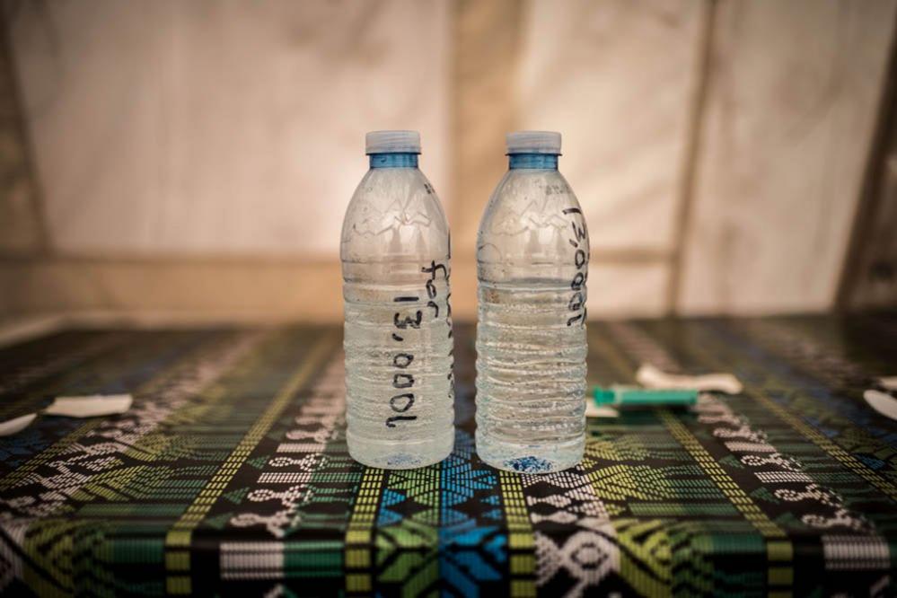 Water samples lie on a table at a Red Cross water treatment plant