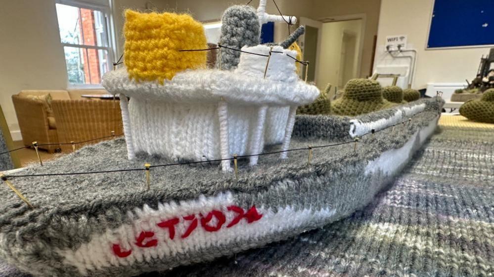 A knitted boat complete with anti aircraft guns 