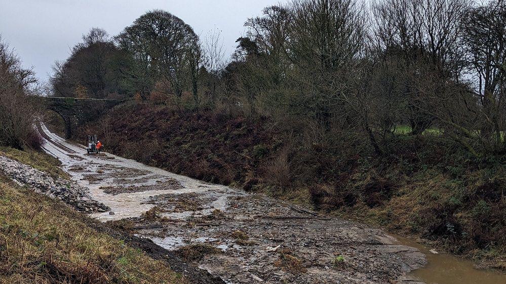 Debris covering the railway track.