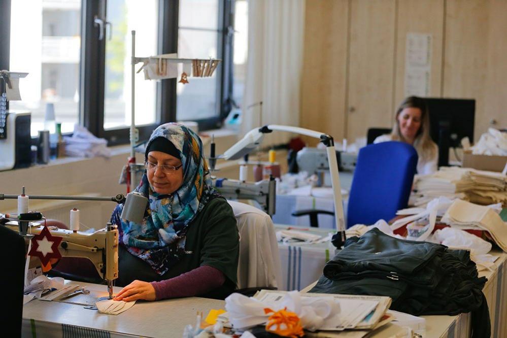 A woman on a sewing machine