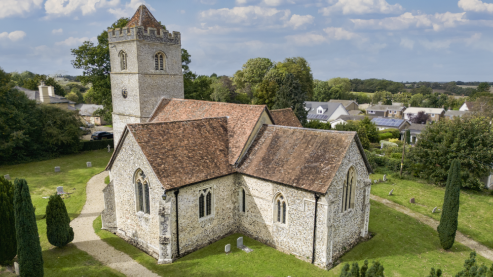 A white church with a red roof.