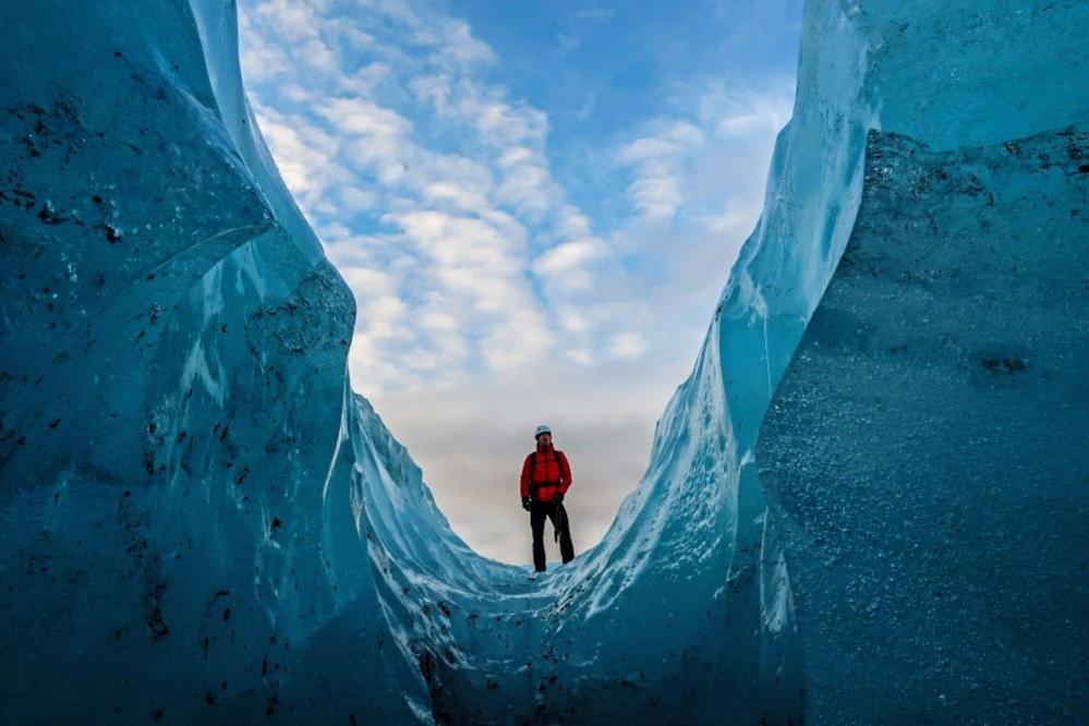 A man inside a glacier