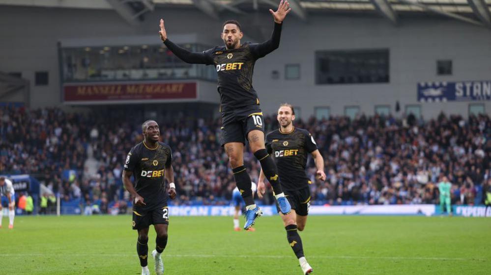 Matheus Cunha jumps in celebration