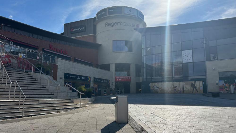 Regent Circus retail and leisure complex in Swindon town centre, with the boarded-up Morrisons store to the right of the image.