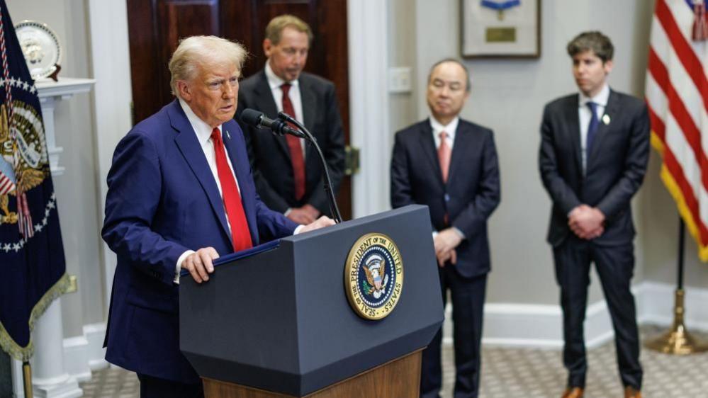 US President Donald Trump (L) gives remarks on artificial intelligence (AI) Infrastructure as Larry Ellison (2-L), Chief technology officer of Oracle, Masayoshi Son (2-R), CEO of SoftBank, Sam Altman (R), CEO of OpenAI look on in the Roosevelt Room of the White House