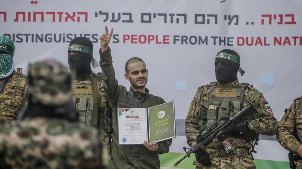 Image shows the Israeli hostage Omer Wenkert shortly before he was handed over to the Red Cross in Al Nusairat refugee camp, central Gaza Strip, on 22 February, 2025
