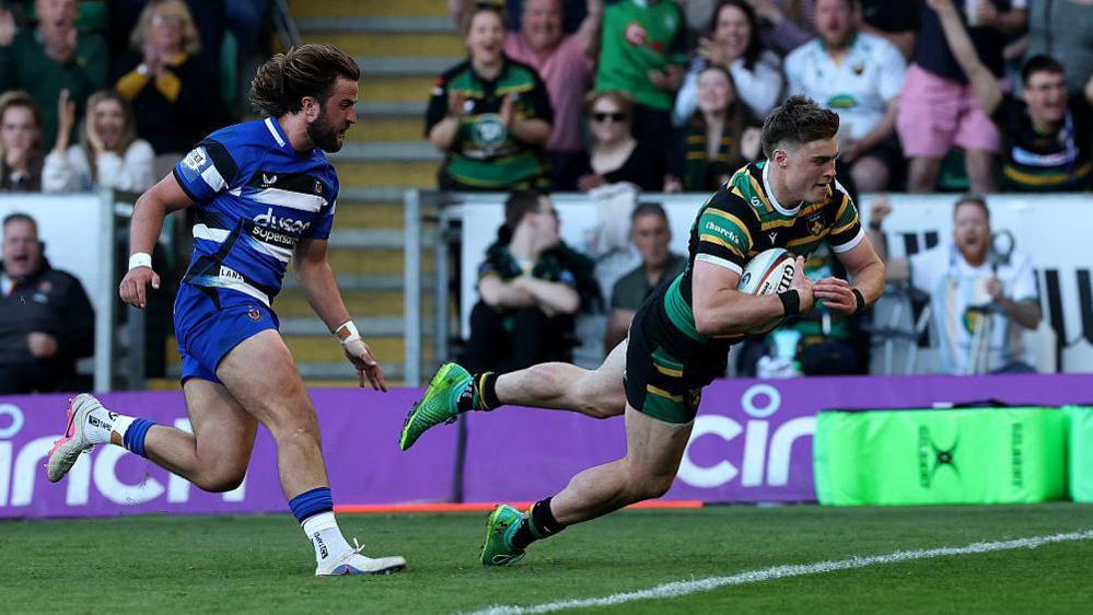Tommy Freeman of Northampton Saints dives in to score his third try during the Gallagher Prem match between Northampton Saints and Bath Rugby at the cinch Stadium at Franklin's Gardens