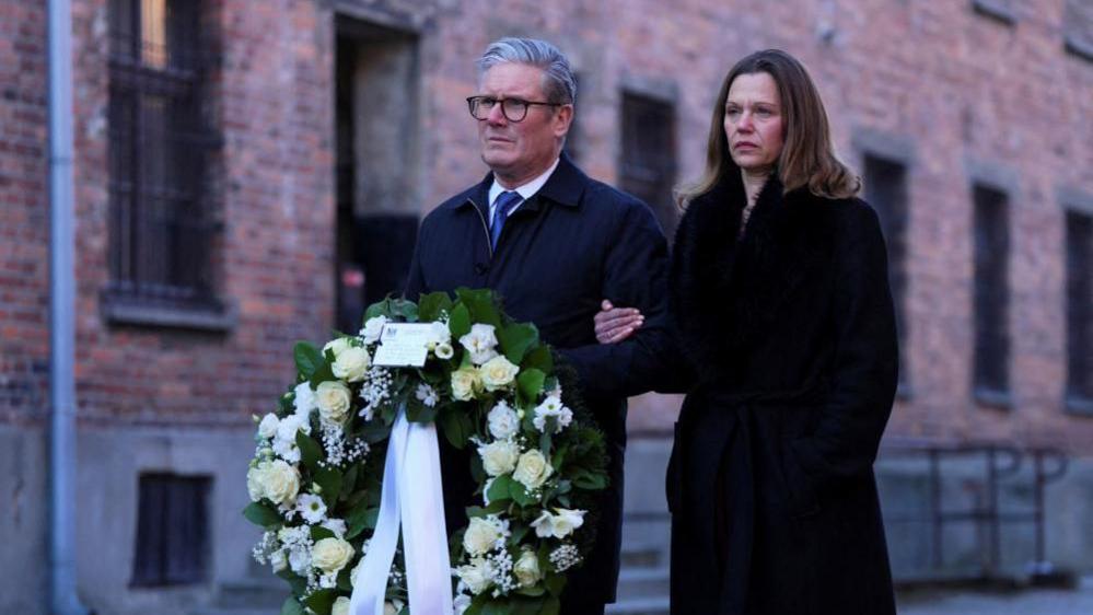 Prime Minister Sir Keir Starmer and his wife Lady Victoria, wait to lay a wreath during their visit to the Memorial and Museum Auschwitz-Birkenau, a former German Nazi concentration and extermination camp, in Oswiecim, during his visit to Poland to begin talks on a new defence and security agreement. Picture date: Friday January 17, 2025.