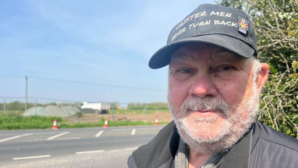 Caister Parish Council chairman Kevin Wood near the access to Persimmon Homes' site at Nova Scotia Farm