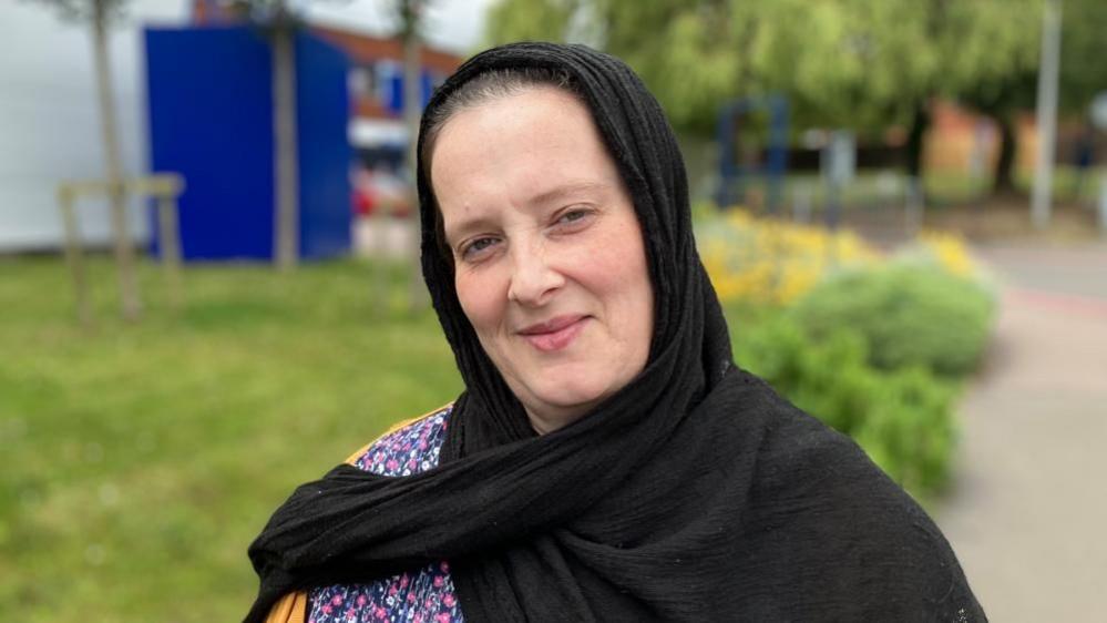 Victoria Gourley wearing a black headscarf at Kettering General Hospital