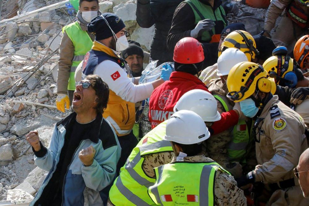 A son of a Turkish woman named Saadet Sendag reacts as his mother is rescued from a collapsed building after 177 hours, in the aftermath of the deadly earthquakes in Turkey and Syria - 13 February, 2023