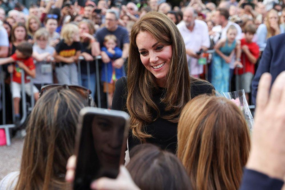 Britain's Catherine, Princess of Wales, greets people outside Windsor Castle