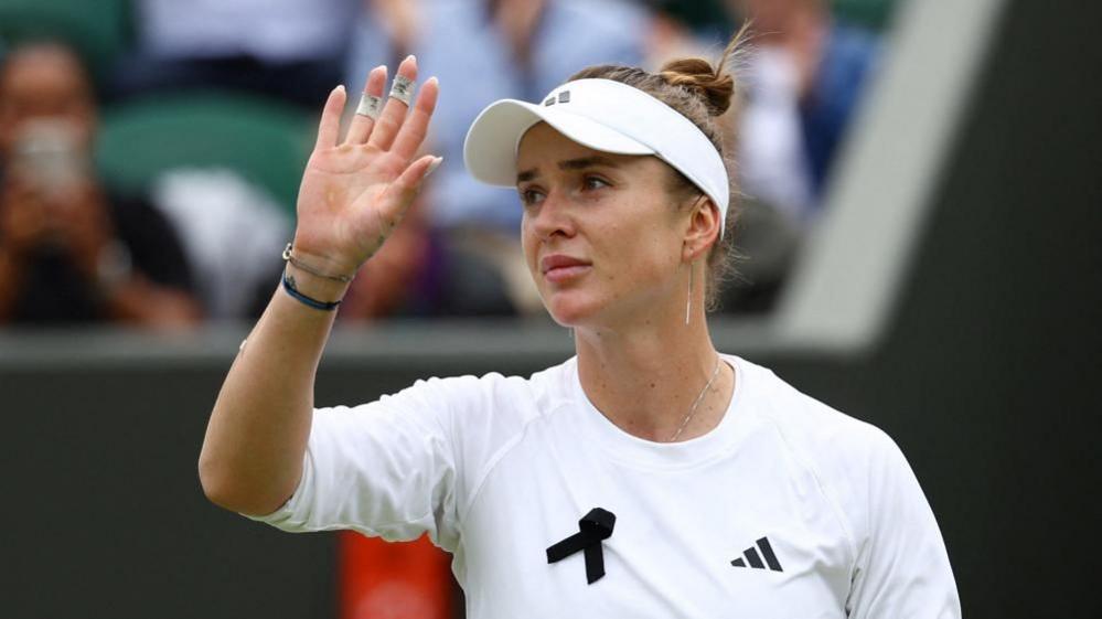 Ukraine's Elina Svitolina wearing a black ribbon while playing at the Wimbledon tennis on Monday