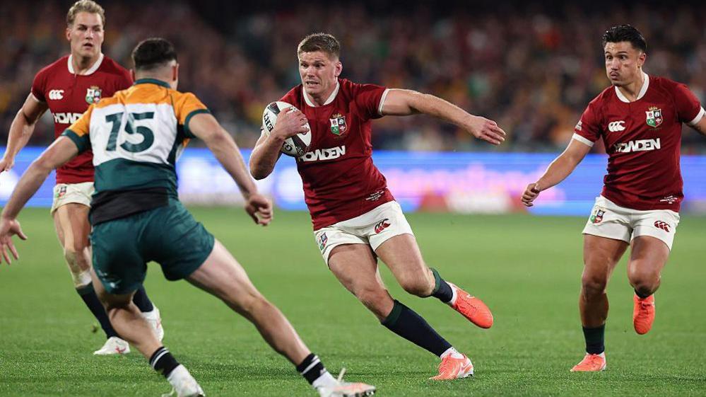 Owen Farrell runs with the ball