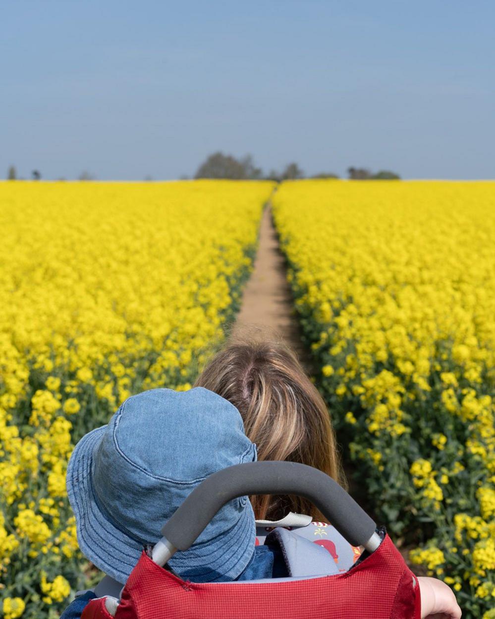 Woman carrying her son