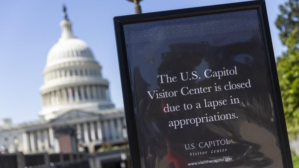 A sign outside the US Capitol says "The US Capitol Visitor Center is closed due to a lapse in appropriations."