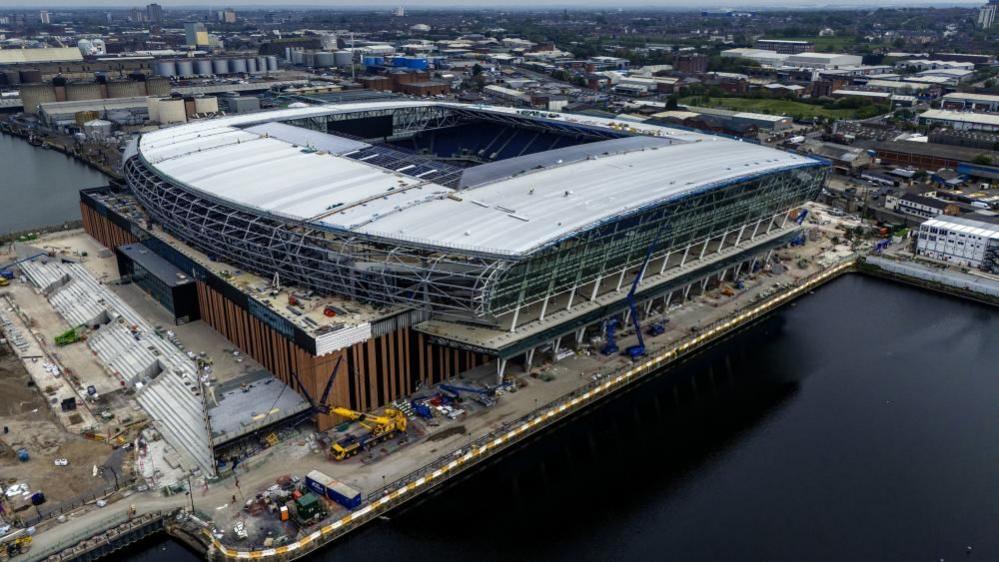 An aerial image of a large football stadium on the docks of Liverpool 