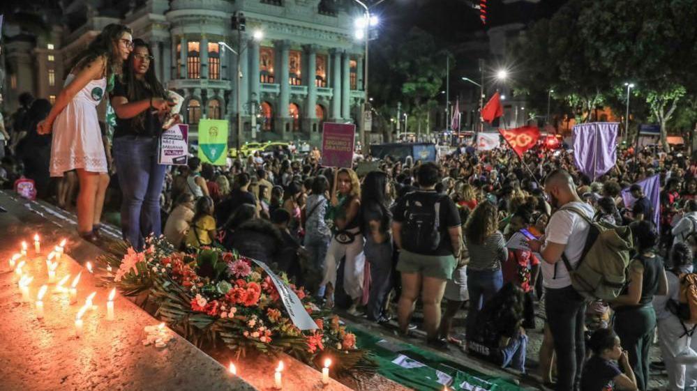 Women participate in a protest against the 1904 bill, a proposed law which restricts legal abortion in cases of rape and equates the procedure to simple homicide, in Cinelandia, Rio de Janeiro, Brazil, 13 June 2024.